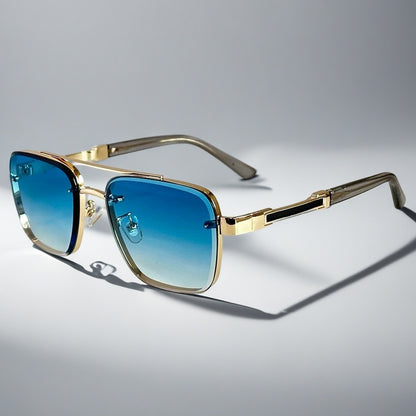 Alma Cruz Gafas de sol Aviator Lucas con montura dorada y cristales degradados azul a transparente.