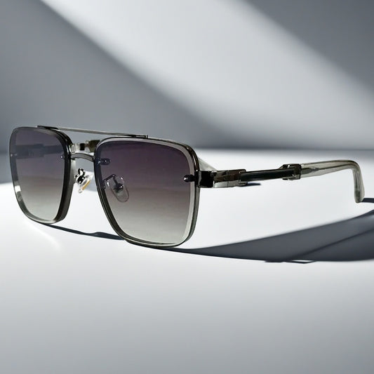 Alma Cruz Gafas de sol aviador con montura metálica dorada y cristales degradados, estilo cuadrado.
