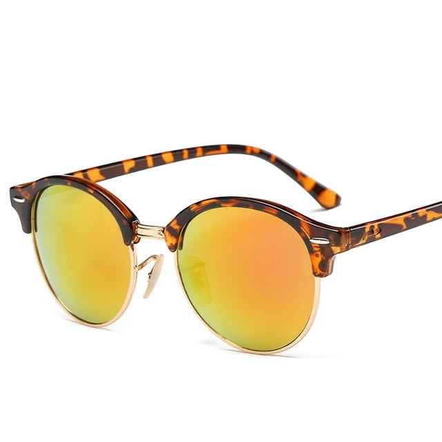 Gafas de sol Alma Cruz modelo Luis con montura de aleación carey y lentes espejadas UV400 naranjas.