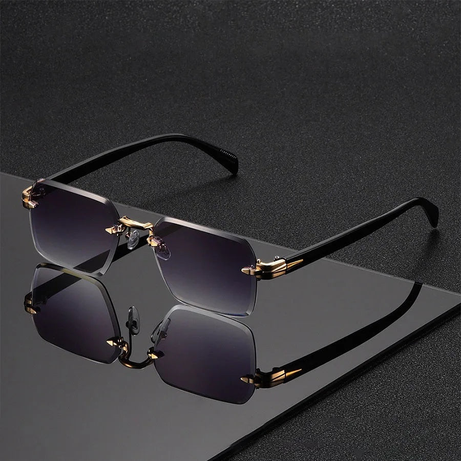 Alma Cruz Fausto gafas de sol sin montura con lentes degradadas y puente dorado