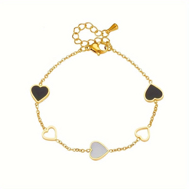 Brazalete Alma Cruz de acero inoxidable bañado en oro con corazones de esmalte negro, blanco y dorado. Ajustable.