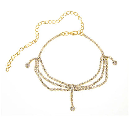 Alma Cruz tobillera dorada de cadena multicapa con diamantes de imitación, accesorio elegante para pies